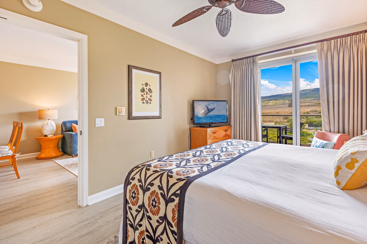 King bedroom suite with plush bedding at Honua Kai penthouse